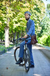 © vetkit - Bearded businessman in helmet with bike.