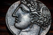 Souvenir Greek coin with the image of the face of the ancient Greek close-up. Copy of an old greek coin drachma