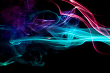 Close-up Of Colorful Abstract Smoke Pattern Against Black Background
