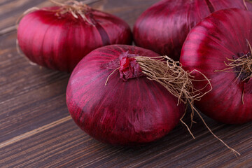 red onions on rustic wood