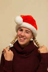 Beautiful young woman in new years hat	