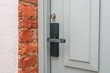 White door to the house, door handle, close up