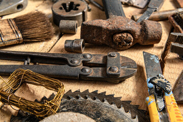 Wall Mural - Old vintage household hand tools still life on a wooden background in a DIY and repair concept