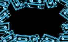 A Frame Of Beautiful Abstract Neon Bright Blue Glowing Old Retro Vintage Hipster Music Audio Cassettes From The 80s, 90s And Copy Space On A Black Background. 
