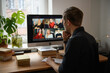© Girts - Work from home. Young man having Zoom video call via a computer in the home office. Stay at home and work from home concept during Coronavirus pandemic. Smiling handsome man teleworking