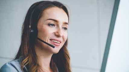 Business people wearing headset working in office to support remote customer or colleague. Call center, telemarketing, customer support agent provide service on telephone video conference call.