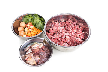 Wall Mural - Ingredients of barf raw food recipe for dogs consisting meat, organs, fish, eggs and vegetable