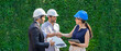© godji10 - Successful teamwork. Female technician and businessman handshake after making an investment deal. Solar energy engineer holding a solar panel.  Concept of Photovoltaic solar, Ecology power.