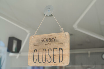 Wall Mural - wooden board text sorry we are closed sign board wood on windows shop restaurant cafe store signboard