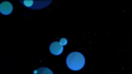 Wall Mural - Beautiful floating bokeh abstract background. Beautiful bokeh or dust particles floating circles for a movie title or launch theme.