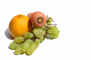 Organic Carrot, Grapes and Orange Fruits Isolated on White Background with Copy Space