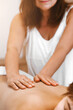© Amina - Close-up view masseur hands doing spin shoulder massage. Selective focus