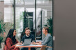 © Lumina/Stocksy - Group of Young Businesspeople Working Together