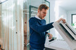 © Lumina/Stocksy - Young Businessman Using Copier