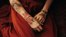 Close Up Of Woman's Tattooed Hands