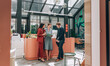 © Lumina/Stocksy - Group of Elegant Modern Businesspeople Working Together