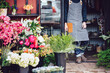 © Trinette Reed/Stocksy - Flower shop owner in storefront