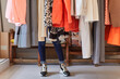 © JAVIER PARDINA/Stocksy - Moments of a woman shopping in a boutique.