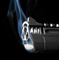 Smoking gun on a dark background