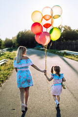 Canvas Print - mother and daughter with balloons