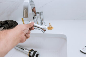 Wall Mural - Plumbing assemble faucet of a sink plumber tools equipment in a bathroom