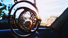 Close-up Of Hourglass Hanging In Car