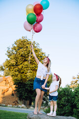 Wall Mural - mother and daughter with balloons