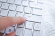 Hands of business woman Pressing enter button on computer keyboard