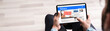 © Andrey Popov - Watching News On Computer Screen Online