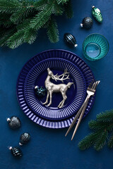 Wall Mural - Christmas festive dinner table setting in dark blue tones