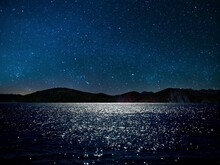 Scenic View Of Lake Against Star Field At Night