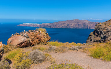 a view from skaros rock on santorini towards the northern rim of the caldera in summertime