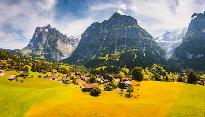 Fototapete - Sunny view of alpine Eiger village. Location place of Grindelwald valley, Switzerland.