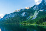 Fototapeta Niebo - Beautiful summer scene of vorderer gosausee lake. Colorful evening view of Salzkammergut berge Alps on the Austrian , Europe. Beauty of nature concept background.