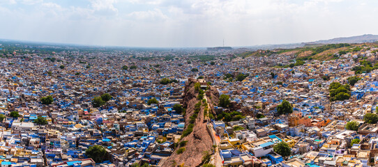 Wall Mural - Panoramic view of Sun city Jodhpur also known as 'Blue City' due to the vivid blue-painted Brahmin houses. It is a popular tourist destination & second largest city in State of Rajasthan, India.