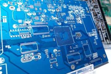 Aufkleber - Blank motherboard for a computer. Blue circuit board close up. Motherboard computer board without processors. PCB without additional elements. Several PCBs stand side by side. PCB on a shop window