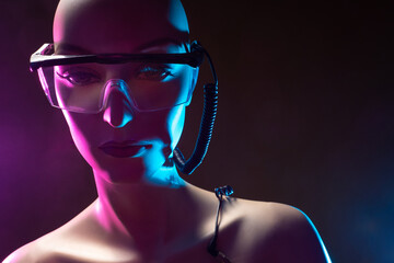 Poster - Cyborg. Droid. Robot design. Robot is made very similar to a woman. Close-up of a cyborg woman's face. Concept - robot design. Droid in large glasses close-up. Design cyborg woman in glasses.