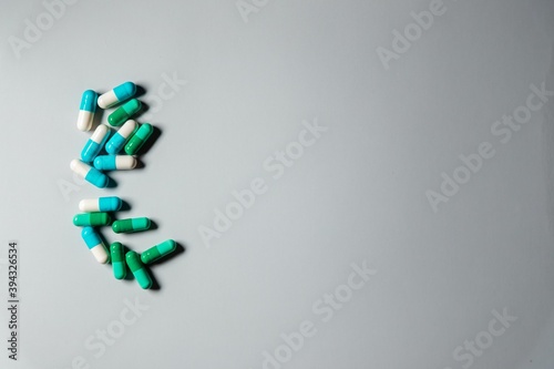 green and blue medication pill