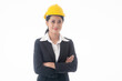 © Arunporn - Young engineer woman wear black suit and yellow safety helmet with arm cross on isolated white background.
