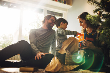 Sticker - Family unwrapping Christmas gifts