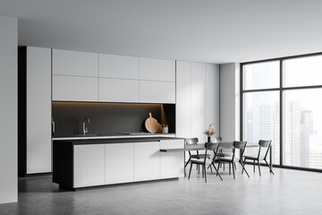 White kitchen corner with table and window