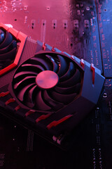 Poster - Computer game graphics card, videocard with two coolers on circuit board ,motherboard background. Close-up. With red-blue lighting