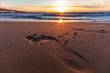 Image of beach footprints in the sand steps walking barefoot 