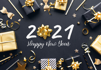Wall Mural - 2021 happy new year celebration concepts with gift box and ornament in golden color on dark backgrou