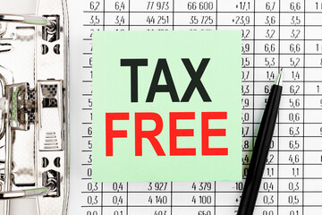 Wall Mural - Text TAX FREE on stickers. Pen and document top view.