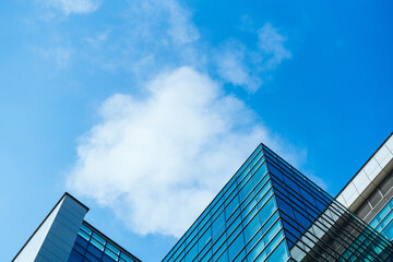 underside panoramic and perspective view to steel blue glass high rise building skyscrapers, business concept of successful industrial architecture