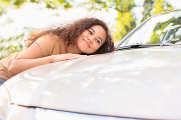 Poster - Happy African-American woman near car outdoors