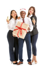 Sticker - Young people with glasses of champagne and gift on white background. Happy Near Year and Merry Christmas celebration