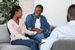 © Prostock-studio - Happy african american couple visiting social worker before adoption