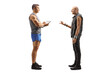 © Ljupco Smokovski - Full length profile shot of a punk man talking to a male fitness trainer